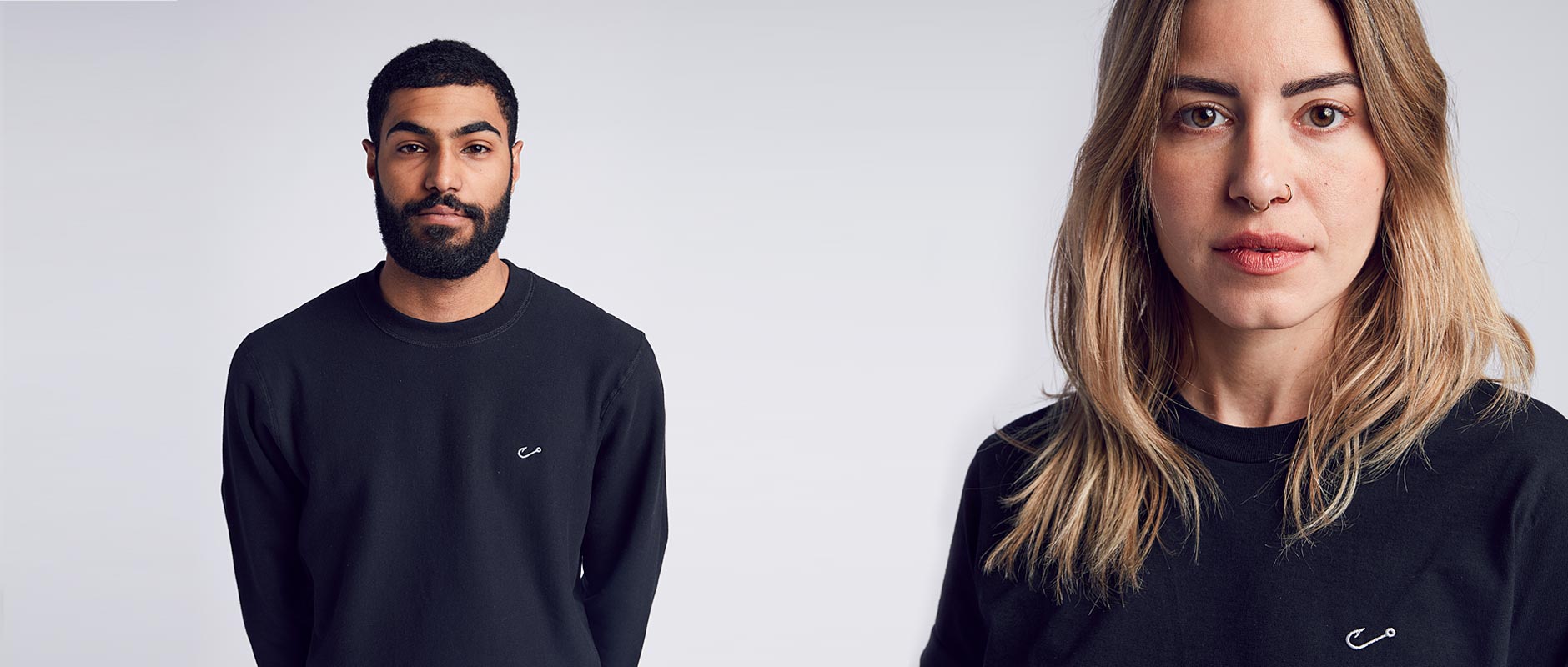 Male and Female models wearing Black Embroidered Hook Crewneck